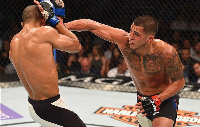 LAS VEGAS, NV - APRIL 23: (R-L) Anthony Pettis punches Edson Barboza in their lightweight bout during the UFC 197 event inside MGM Grand Garden Arena on April 23, 2016 in Las Vegas, Nevada. (Photo by Josh Hedges/Zuffa LLC/Zuffa LLC via Getty Images)