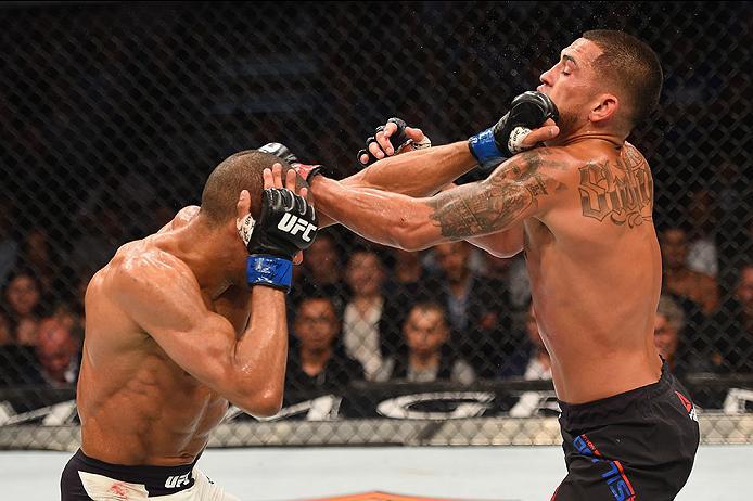 LAS VEGAS, NV - APRIL 23: (L-R) Edson Barboza punches Anthony Pettis in their lightweight bout during the UFC 197 event inside MGM Grand Garden Arena on April 23, 2016 in Las Vegas, Nevada. (Photo by Josh Hedges/Zuffa LLC/Zuffa LLC via Getty Images)