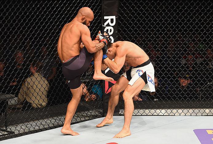 LAS VEGAS, NV - APRIL 23: (L-R) Demetrious Johnson knees Henry Cejudo in their flyweight championship bout during the UFC 197 event inside MGM Grand Garden Arena on April 23, 2016 in Las Vegas, Nevada. (Photo by Josh Hedges/Zuffa LLC/Zuffa LLC via Getty