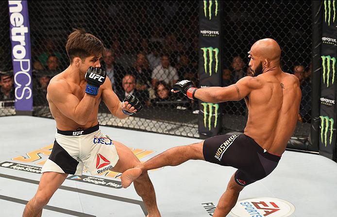 LAS VEGAS, NV - APRIL 23: (R-L) Demetrious Johnson kicks Henry Cejudo in their flyweight championship bout during the UFC 197 event inside MGM Grand Garden Arena on April 23, 2016 in Las Vegas, Nevada. (Photo by Josh Hedges/Zuffa LLC/Zuffa LLC via Getty