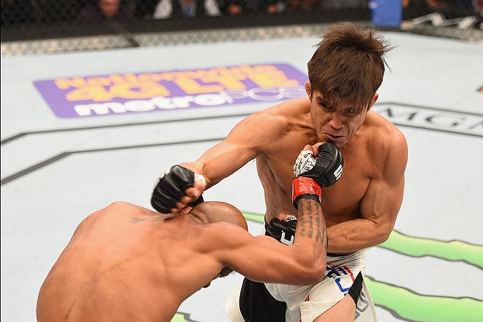 LAS VEGAS, NV - APRIL 23: (R-L) Henry Cejudo punches Demetrious Johnson in their flyweight championship bout during the UFC 197 event inside MGM Grand Garden Arena on April 23, 2016 in Las Vegas, Nevada. (Photo by Josh Hedges/Zuffa LLC/Zuffa LLC via Get