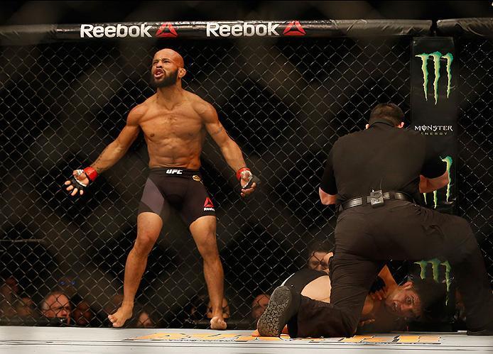 LAS VEGAS, NV - APRIL 23: Demetrious Johnson celebrates his TKO victory over Henry Cejudo in their flyweight championship bout during the UFC 197 event inside MGM Grand Garden Arena on April 23, 2016 in Las Vegas, Nevada. (Photo by Christian Petersen/Zu