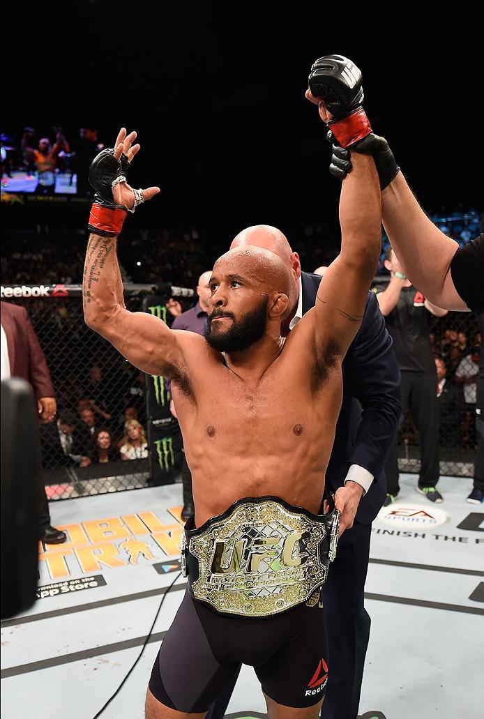 LAS VEGAS, NV - APRIL 23: Demetrious Johnson celebrates his TKO victory over Henry Cejudo in their flyweight championship bout during the UFC 197 event inside MGM Grand Garden Arena on April 23, 2016 in Las Vegas, Nevada. (Photo by Josh Hedges/Zuffa LLC