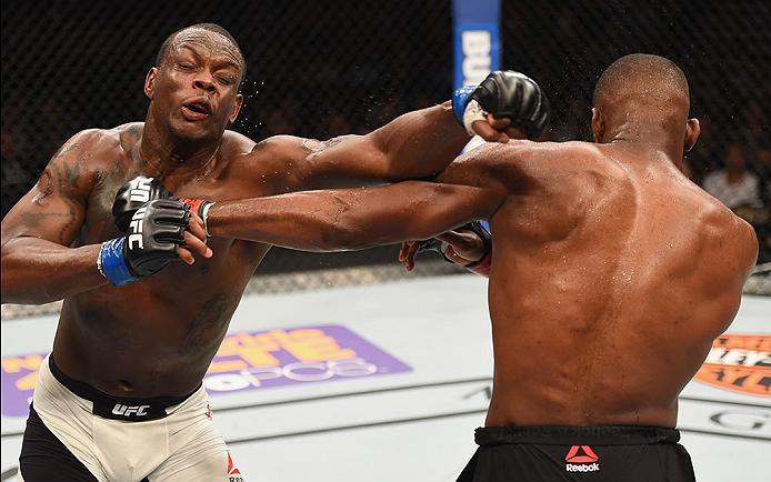 LAS VEGAS, NV - APRIL 23: (L-R) Ovince Saint Preux exchange punches with Jon Jones in their interim UFC light heavyweight championship bout during the UFC 197 event inside MGM Grand Garden Arena on April 23, 2016 in Las Vegas, Nevada. (Photo by Josh Hed