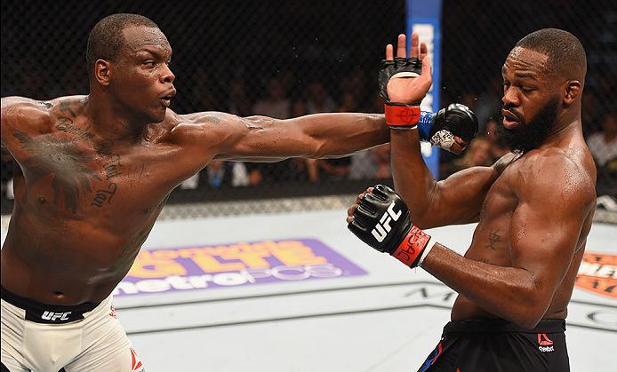 LAS VEGAS, NV - APRIL 23: (L-R) Ovince Saint Preux punches Jon Jones in their interim UFC light heavyweight championship bout during the UFC 197 event inside MGM Grand Garden Arena on April 23, 2016 in Las Vegas, Nevada. (Photo by Josh Hedges/Zuffa LLC/