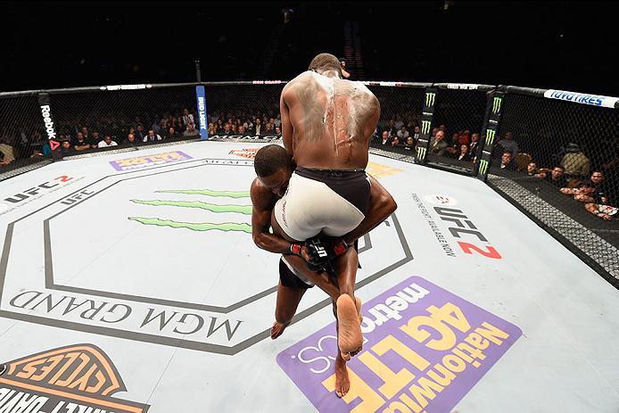 LAS VEGAS, NV - APRIL 23: (L-R) Jon Jones picks up Ovince Saint Preux in their interim UFC light heavyweight championship bout during the UFC 197 event inside MGM Grand Garden Arena on April 23, 2016 in Las Vegas, Nevada. (Photo by Josh Hedges/Zuffa LLC