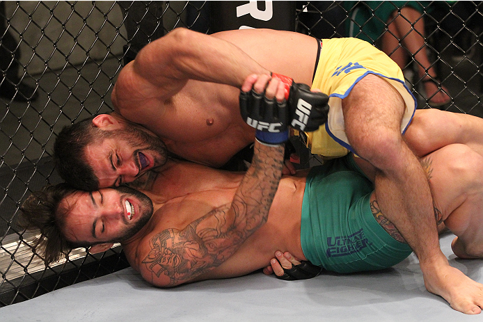 SAO PAULO, BRAZIL - JANUARY 24: (R-L) Team Wanderlei fighter Ricardo Abreu controls the body of Team Sonnen fighter Guilherme de Vasconcelos in their middleweight fight during season three of The Ultimate Fighter Brazil on January 24, 2014 in Sao Paulo,