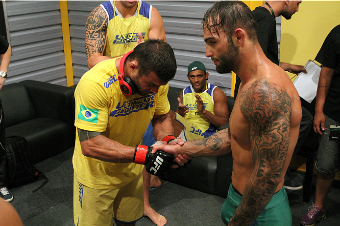SAO PAULO, BRAZIL - JANUARY 24: (R-L) Team Sonnen fighter Guilherme de Vasconcelos congratulates Team Wanderlei fighter Ricardo Abreu after Ricardo defeated Guilherme by split decision in their middleweight fight during season three of The Ultimate Fight