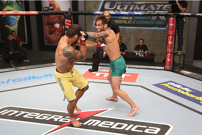 SAO PAULO, BRAZIL - JANUARY 24: (R-L) Team Sonnen fighter Guilherme de Vasconcelos punches Team Wanderlei fighter Ricardo Abreu in their middleweight fight during season three of The Ultimate Fighter Brazil on January 24, 2014 in Sao Paulo, Brazil. (Phot