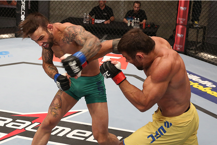 SAO PAULO, BRAZIL - JANUARY 24: (L-R) Team Sonnen fighter Guilherme de Vasconcelos punches Team Wanderlei fighter Ricardo Abreu in their middleweight fight during season three of The Ultimate Fighter Brazil on January 24, 2014 in Sao Paulo, Brazil. (Phot