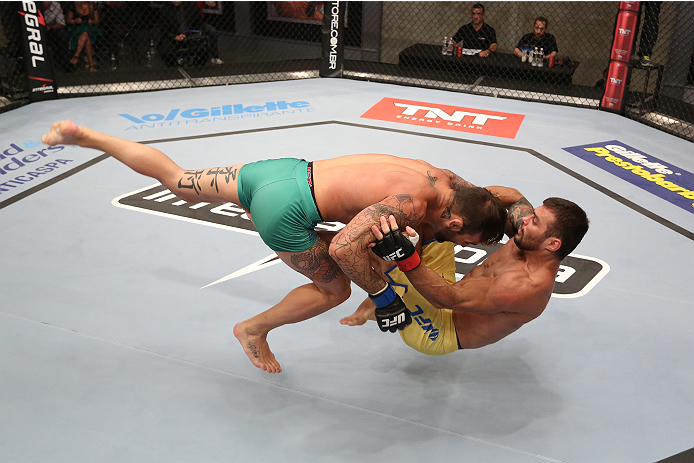 SAO PAULO, BRAZIL - JANUARY 24: (L-R) Team Sonnen fighter Guilherme de Vasconcelos takes down Team Wanderlei fighter Ricardo Abreu in their middleweight fight during season three of The Ultimate Fighter Brazil on January 24, 2014 in Sao Paulo, Brazil. (P