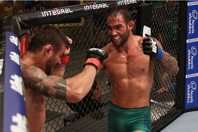 SAO PAULO, BRAZIL - JANUARY 24: (R-L) Team Sonnen fighter Guilherme de Vasconcelos punches Team Wanderlei fighter Ricardo Abreu in their middleweight fight during season three of The Ultimate Fighter Brazil on January 24, 2014 in Sao Paulo, Brazil. (Phot