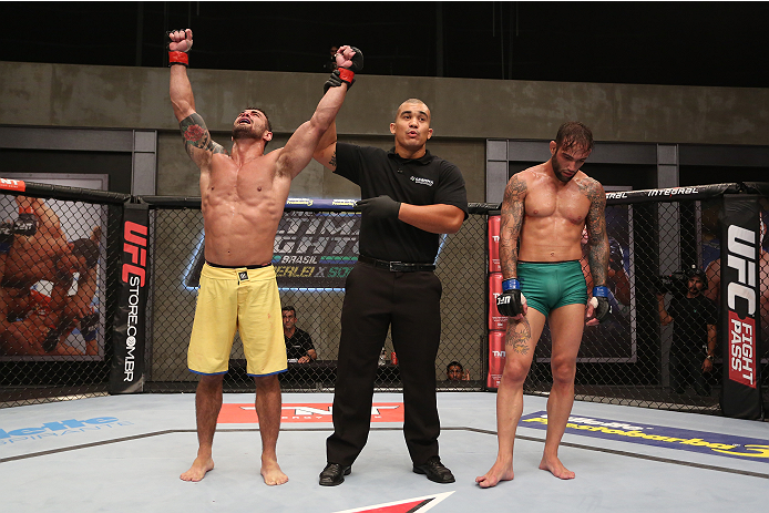 SAO PAULO, BRAZIL - JANUARY 24: (L-R) Team Wanderlei fighter Ricardo Abreu celebrates after defeating Team Sonnen fighter Guilherme de Vasconcelos in their middleweight fight during season three of The Ultimate Fighter Brazil on January 24, 2014 in Sao P
