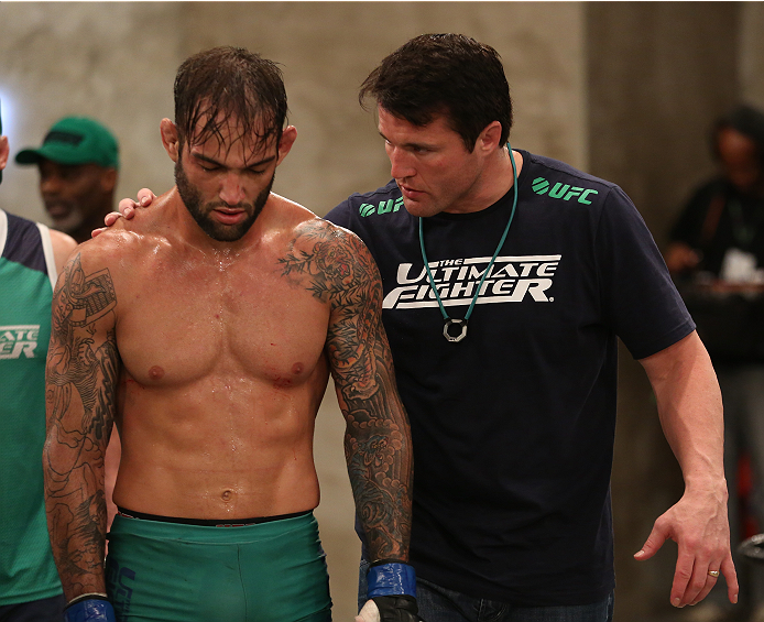 SAO PAULO, BRAZIL - JANUARY 24: (L-R) Team Sonnen fighter Guilherme de Vasconcelos is consoled by coach Chael Sonnen after Guilherme was defeated by Team Wanderlei fighter Ricardo Abreu in their middleweight fight during season three of The Ultimate Figh