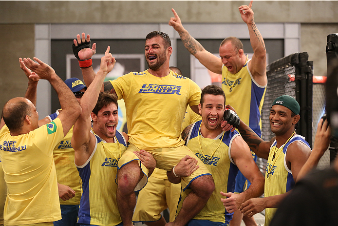 SAO PAULO, BRAZIL - JANUARY 24: Team Wanderlei fighter Ricardo Abreu celebrates with his teammates after defeating Team Sonnen fighter Guilherme de Vasconcelos in their middleweight fight during season three of The Ultimate Fighter Brazil on January 24,