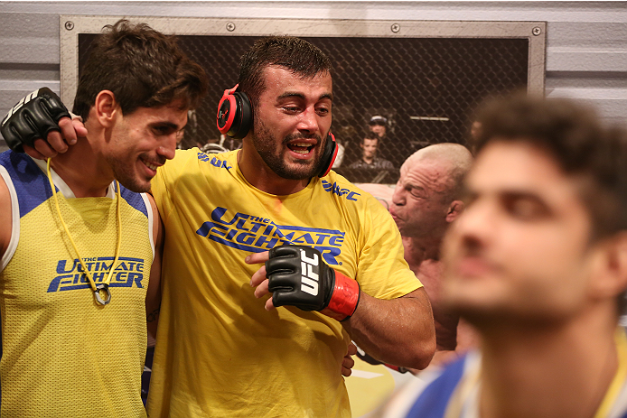 SAO PAULO, BRAZIL - JANUARY 24: (R-L) Team Wanderlei fighter Ricardo Abreu is embraced by teammate Antonio Carlos Junior after defeating Team Sonnen fighter Guilherme de Vasconcelos in their middleweight fight during season three of The Ultimate Fighter