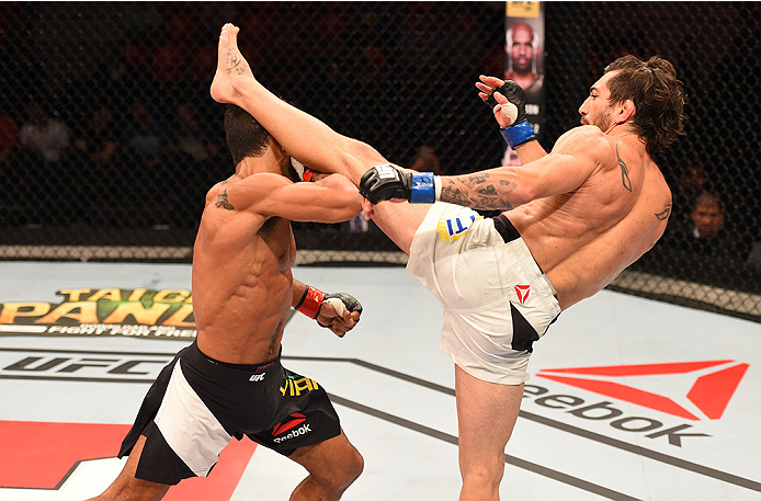 RIO DE JANEIRO, BRAZIL - AUGUST 01: (R-L) Guido Cannetti of Argentina kicks Hugo Viana of Brazil in their bantamweight bout during the UFC 190 event inside HSBC Arena on August 1, 2015 in Rio de Janeiro, Brazil. (Photo by Josh Hedges/Zuffa LLC/Zuffa LL