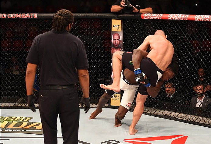 RIO DE JANEIRO, BRAZIL - AUGUST 01: Clint Hester of the United States takes down Vitor Miranda of Brazil in their middleweight bout during the UFC 190 event inside HSBC Arena on August 1, 2015 in Rio de Janeiro, Brazil. (Photo by Josh Hedges/Zuffa LLC/Z