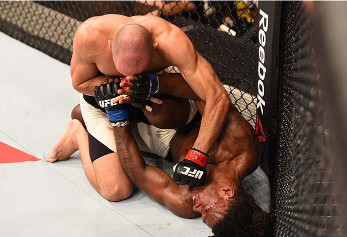 RIO DE JANEIRO, BRAZIL - AUGUST 01: Vitor Miranda of Brazil (top) punches Clint Hester of the United States in their middleweight bout during the UFC 190 event inside HSBC Arena on August 1, 2015 in Rio de Janeiro, Brazil. (Photo by Josh Hedges/Zuffa LL