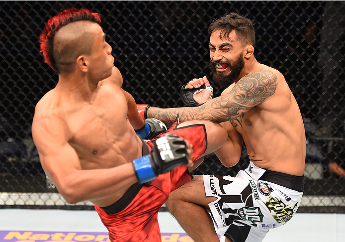 NEW ORLEANS, LA - JUNE 06: Leonardo Morales kicks Jose Quinonez in their bantamweight bout during the UFC event at the Smoothie King Center on June 6, 2015 in New Orleans, Louisiana. (Photo by Josh Hedges/Zuffa LLC/Zuffa LLC via Getty Images)