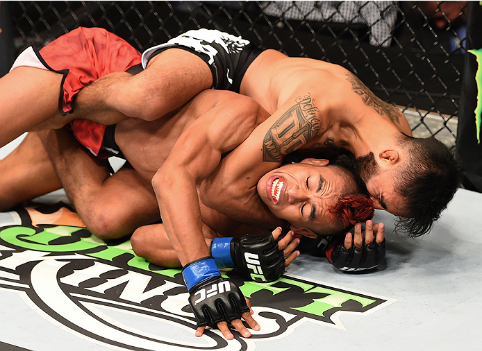 NEW ORLEANS, LA - JUNE 06: Jose Quinonez (top) submits Leonardo Morales in their bantamweight bout during the UFC event at the Smoothie King Center on June 6, 2015 in New Orleans, Louisiana. (Photo by Josh Hedges/Zuffa LLC/Zuffa LLC via Getty Images)