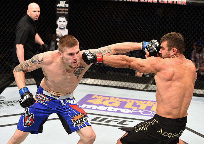 NEW ORLEANS, LA - JUNE 06: (R-L) Ricardo Abreu exchanges punches with Jake Collier in their middleweight bout during the UFC event at the Smoothie King Center on June 6, 2015 in New Orleans, Louisiana. (Photo by Josh Hedges/Zuffa LLC/Zuffa LLC via Getty