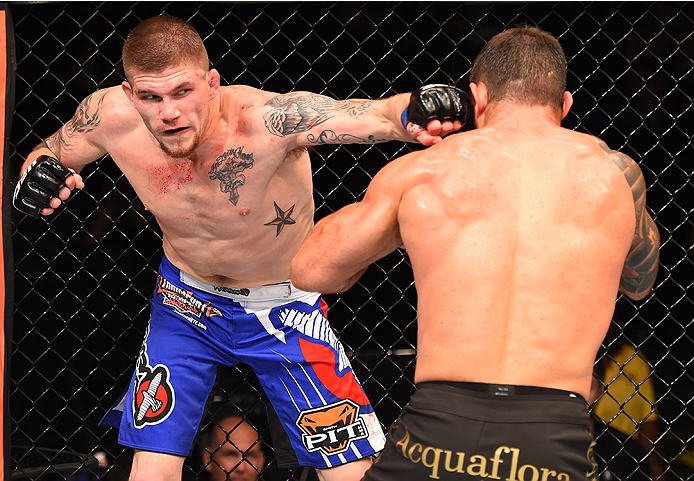 NEW ORLEANS, LA - JUNE 06: (L-R) Jake Collier punches Ricardo Abreu in their middleweight bout during the UFC event at the Smoothie King Center on June 6, 2015 in New Orleans, Louisiana. (Photo by Josh Hedges/Zuffa LLC/Zuffa LLC via Getty Images)