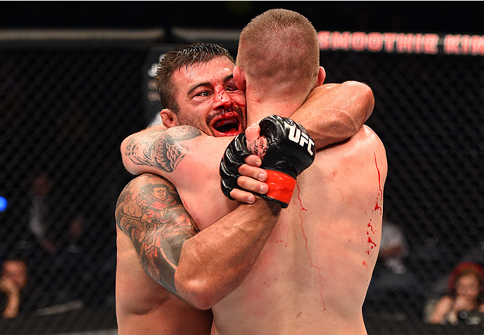 NEW ORLEANS, LA - JUNE 06: (L-R) Ricardo Abreu hugs Jake Collier after their middleweight bout during the UFC event at the Smoothie King Center on June 6, 2015 in New Orleans, Louisiana. (Photo by Josh Hedges/Zuffa LLC/Zuffa LLC via Getty Images)
