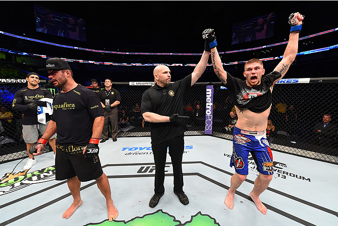 NEW ORLEANS, LA - JUNE 06: (R-L) Jake Collier celebrates his victory over Ricardo Abreu in their middleweight bout during the UFC event at the Smoothie King Center on June 6, 2015 in New Orleans, Louisiana. (Photo by Josh Hedges/Zuffa LLC/Zuffa LLC via G