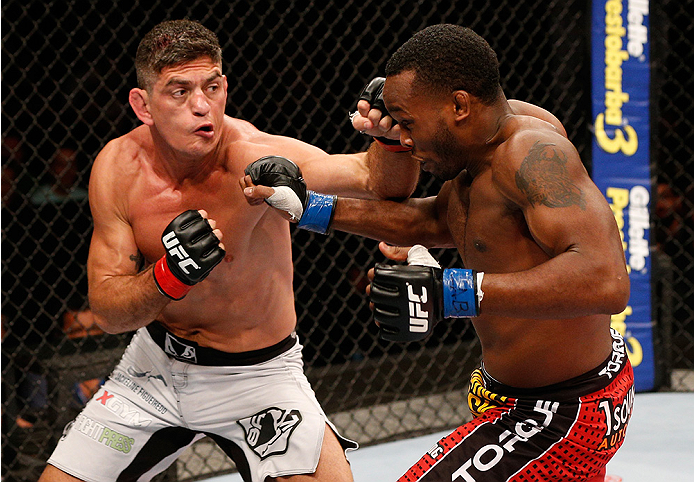 BRASILIA, BRAZIL - SEPTEMBER 13: (L-R) Paulo Thiago punches Sean Spencer in their welterweight bout during the UFC Fight Night event inside Nilson Nelson Gymnasium on September 13, 2014 in Brasilia, Brazil. (Photo by Josh Hedges/Zuffa LLC/Zuffa LLC via Ge