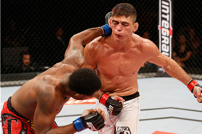 BRASILIA, BRAZIL - SEPTEMBER 13: (L-R) Sean Spencer punches Paulo Thiago in their welterweight bout during the UFC Fight Night event inside Nilson Nelson Gymnasium on September 13, 2014 in Brasilia, Brazil. (Photo by Josh Hedges/Zuffa LLC/Zuffa LLC via Ge