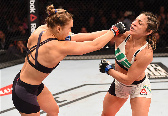 RIO DE JANEIRO, BRAZIL - AUGUST 01: (L-R) Ronda Rousey of the United States punches Bethe Correia of Brazil in their UFC women's bantamweight championship bout during the UFC 190 event inside HSBC Arena on August 1, 2015 in Rio de Janeiro, Brazil. (Phot