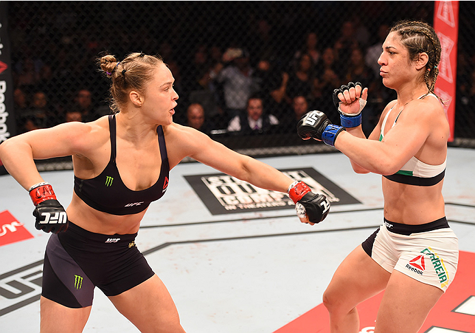 RIO DE JANEIRO, BRAZIL - AUGUST 01: (L-R) Ronda Rousey of the United States throws a punch at Bethe Correia of Brazil in their UFC women's bantamweight championship bout during the UFC 190 event inside HSBC Arena on August 1, 2015 in Rio de Janeiro, Braz