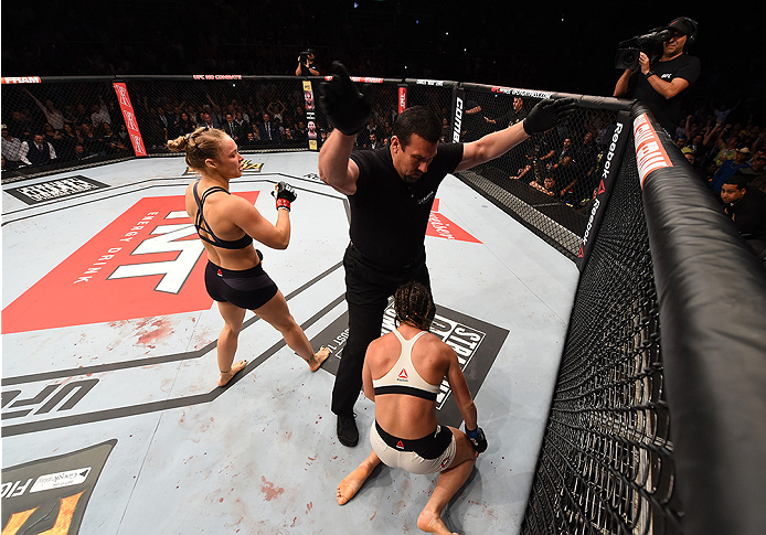 RIO DE JANEIRO, BRAZIL - AUGUST 01: (L-R) Ronda Rousey of the United States knocks out Bethe Correia of Brazil in the first round in their UFC women's bantamweight championship bout during the UFC 190 event inside HSBC Arena on August 1, 2015 in Rio de J