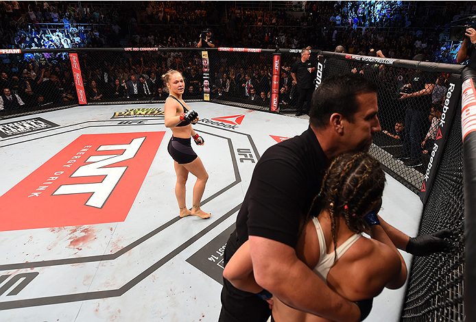 RIO DE JANEIRO, BRAZIL - AUGUST 01: (L-R) Ronda Rousey of the United States knocks out Bethe Correia of Brazil in the first round in their UFC women's bantamweight championship bout during the UFC 190 event inside HSBC Arena on August 1, 2015 in Rio de J
