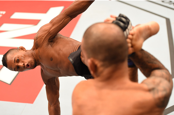 RIO DE JANEIRO, BRAZIL - AUGUST 01: (L-R) Iuri Alcantara of Brazil kicks Leandro Issa of Brazil in their bantamweight bout during the UFC 190 event inside HSBC Arena on August 1, 2015 in Rio de Janeiro, Brazil. (Photo by Josh Hedges/Zuffa LLC/Zuffa LLC