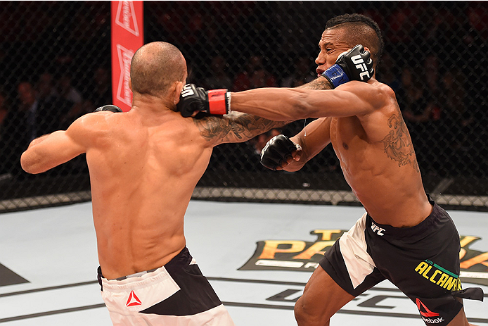 RIO DE JANEIRO, BRAZIL - AUGUST 01: (R-L) Iuri Alcantara of Brazil exchanges punches with Leandro Issa of Brazil in their bantamweight bout during the UFC 190 event inside HSBC Arena on August 1, 2015 in Rio de Janeiro, Brazil. (Photo by Josh Hedges/Zuf