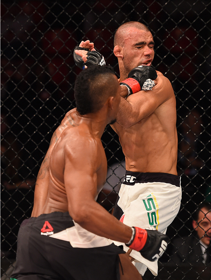 RIO DE JANEIRO, BRAZIL - AUGUST 01: (L-R) Iuri Alcantara of Brazil punches Leandro Issa of Brazil in their bantamweight bout during the UFC 190 event inside HSBC Arena on August 1, 2015 in Rio de Janeiro, Brazil. (Photo by Josh Hedges/Zuffa LLC/Zuffa LL