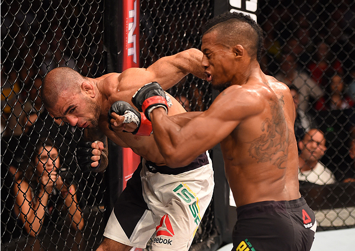 RIO DE JANEIRO, BRAZIL - AUGUST 01: (L-R) Leandro Issa of Brazil punches Iuri Alcantara of Brazil in their bantamweight bout during the UFC 190 event inside HSBC Arena on August 1, 2015 in Rio de Janeiro, Brazil. (Photo by Josh Hedges/Zuffa LLC/Zuffa LL