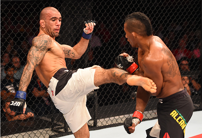 RIO DE JANEIRO, BRAZIL - AUGUST 01: (L-R) Leandro Issa of Brazil kicks Iuri Alcantara of Brazil in their bantamweight bout during the UFC 190 event inside HSBC Arena on August 1, 2015 in Rio de Janeiro, Brazil. (Photo by Josh Hedges/Zuffa LLC/Zuffa LLC
