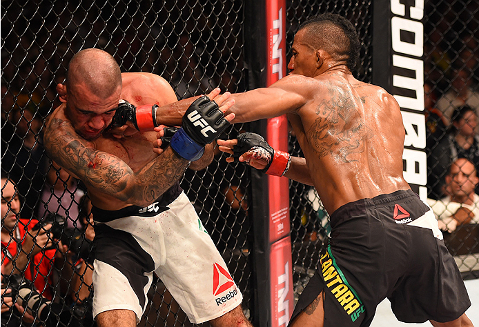 RIO DE JANEIRO, BRAZIL - AUGUST 01: (R-L) Iuri Alcantara of Brazil punches Leandro Issa of Brazil in their bantamweight bout during the UFC 190 event inside HSBC Arena on August 1, 2015 in Rio de Janeiro, Brazil. (Photo by Josh Hedges/Zuffa LLC/Zuffa LL