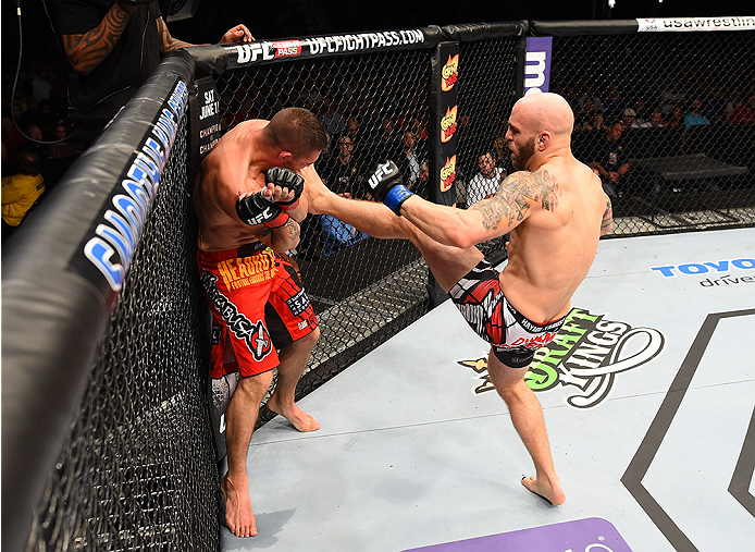 NEW ORLEANS, LA - JUNE 06: (R-L) Justin Edwards kicks Joe Proctor in their lightweight bout during the UFC event at the Smoothie King Center on June 6, 2015 in New Orleans, Louisiana. (Photo by Josh Hedges/Zuffa LLC/Zuffa LLC via Getty Images)