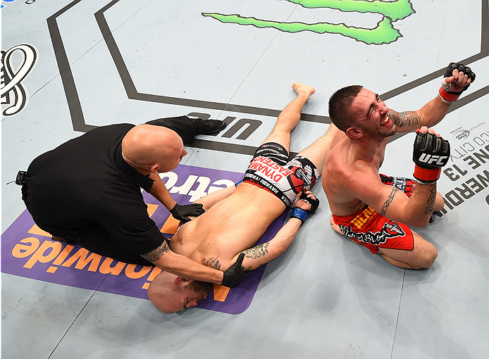 NEW ORLEANS, LA - JUNE 06: (R-L) Joe Proctor celebrates his submission victory over Justin Edwards in their lightweight bout during the UFC event at the Smoothie King Center on June 6, 2015 in New Orleans, Louisiana. (Photo by Josh Hedges/Zuffa LLC/Zuff