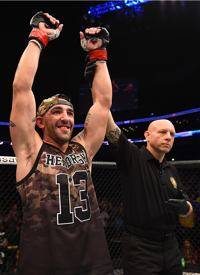 NEW ORLEANS, LA - JUNE 06: Joe Proctor celebrates his submission victory over Justin Edwards in their lightweight bout during the UFC event at the Smoothie King Center on June 6, 2015 in New Orleans, Louisiana. (Photo by Josh Hedges/Zuffa LLC/Zuffa LLC