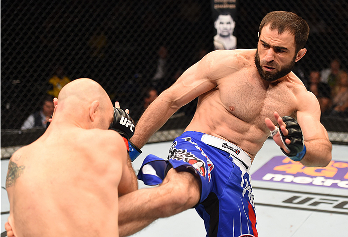 NEW ORLEANS, LA - JUNE 06: (R-L) Omari Akhmedov kicks Brian Ebersole in their welterweight bout during the UFC event at the Smoothie King Center on June 6, 2015 in New Orleans, Louisiana. (Photo by Josh Hedges/Zuffa LLC/Zuffa LLC via Getty Images)