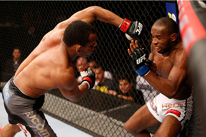 BRASILIA, BRAZIL - SEPTEMBER 13: (L-R) Francisco Trinaldo of Brazil punches Leandro Silva of Brazil in their lightweight bout during the UFC Fight Night event inside Nilson Nelson Gymnasium on September 13, 2014 in Brasilia, Brazil. (Photo by Josh Hedge