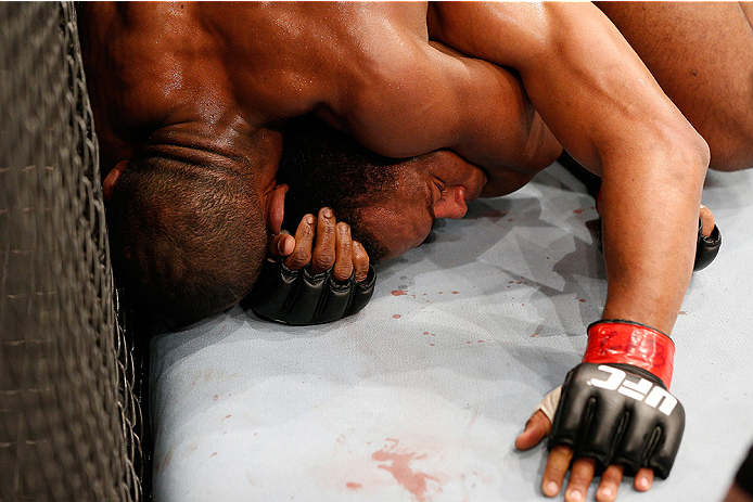 BRASILIA, BRAZIL - SEPTEMBER 13: (L-R) Leandro Silva of Brazil attempts to secure a rear choke agianst Francisco Trinaldo of Brazil in their lightweight bout during the UFC Fight Night event inside Nilson Nelson Gymnasium on September 13, 2014 in Brasili