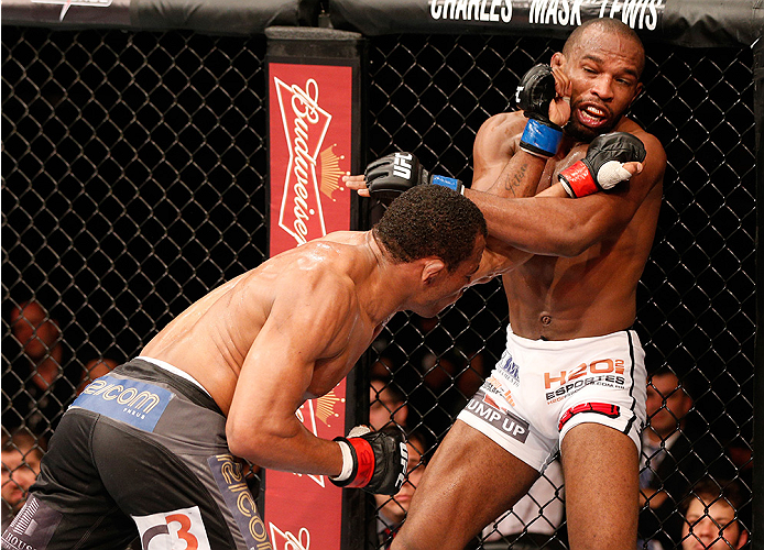 BRASILIA, BRAZIL - SEPTEMBER 13: (L-R) Francisco Trinaldo of Brazil punches Leandro Silva of Brazil in their lightweight bout during the UFC Fight Night event inside Nilson Nelson Gymnasium on September 13, 2014 in Brasilia, Brazil. (Photo by Josh Hedge