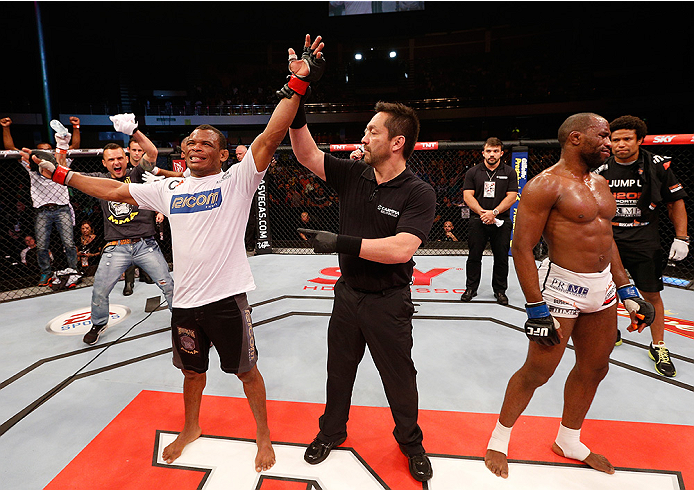 BRASILIA, BRAZIL - SEPTEMBER 13: Francisco Trinaldo (L) of Brazil celebrates after his unanimous-decision victory over Leandro Silva of Brazil in their lightweight bout during the UFC Fight Night event inside Nilson Nelson Gymnasium on September 13, 2014