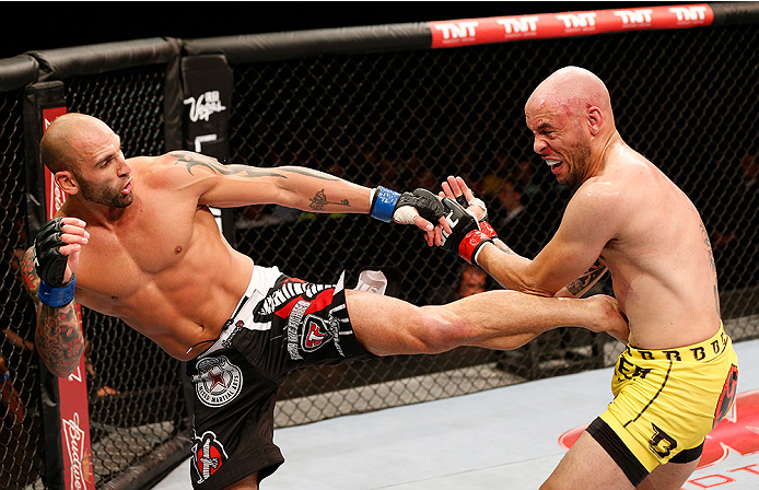 BRASILIA, BRAZIL - SEPTEMBER 13: (L-R) George Sullivan kicks Igor Araujo of Brazil in their welterweight bout during the UFC Fight Night event inside Nilson Nelson Gymnasium on September 13, 2014 in Brasilia, Brazil. (Photo by Josh Hedges/Zuffa LLC/Zuffa